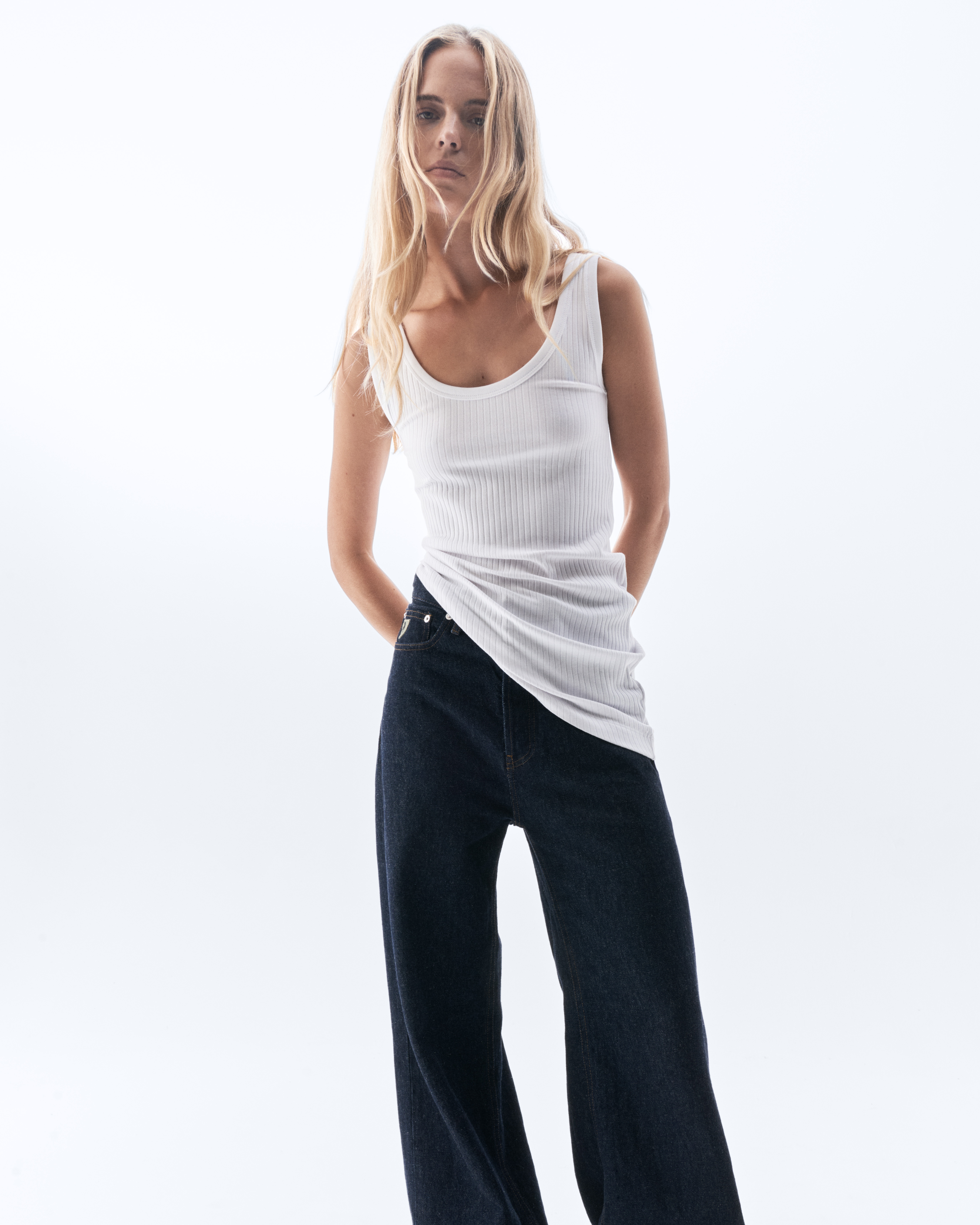 the good stuff campaign — white tank top, wide-leg denim